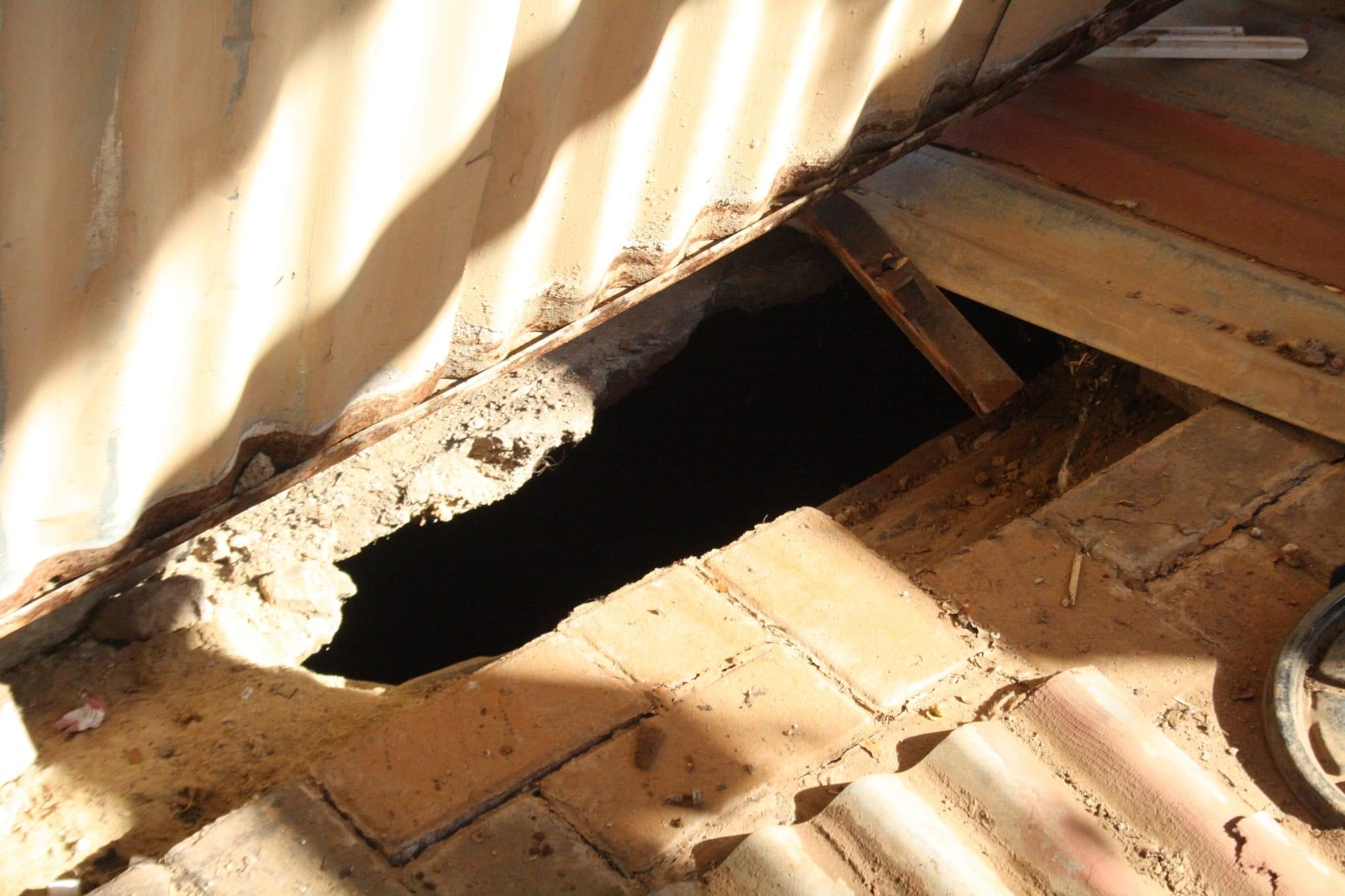 The deep sinkhole in the yard of teh Kambule family. Photo by Sonqoba Kunene
