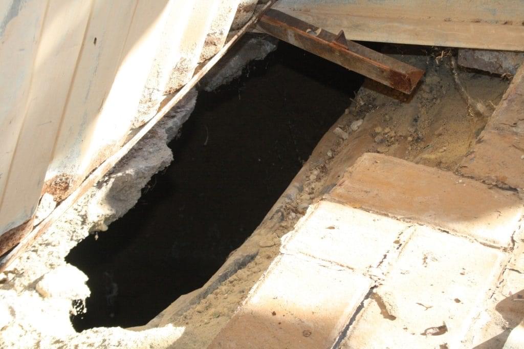 Deep sinkhole scares family 2 The hole in the ground which leads to a dark deep sinkhole underneath. Photo by Sonqoba Kunene